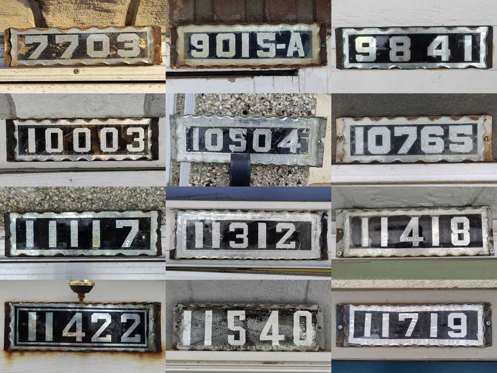 Twelve old house number plates sharing similar characteristics.