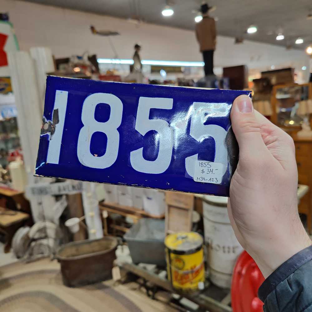 A Regina house number plate, available for $34 at an antique mall.