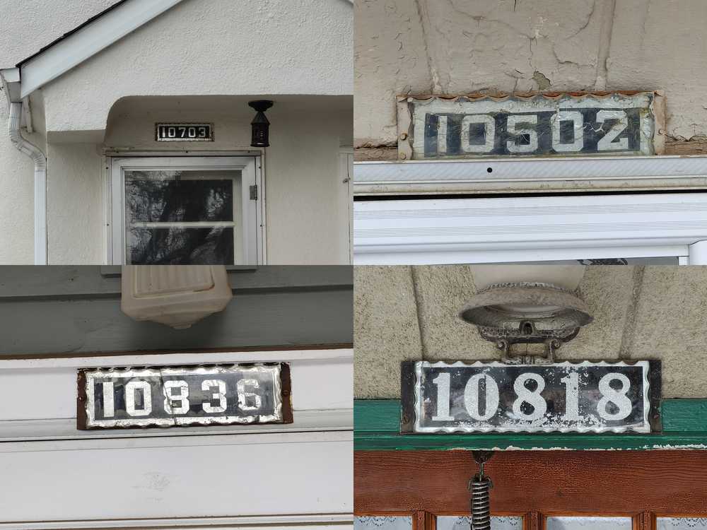 Four old glass-and-foil house number plates.