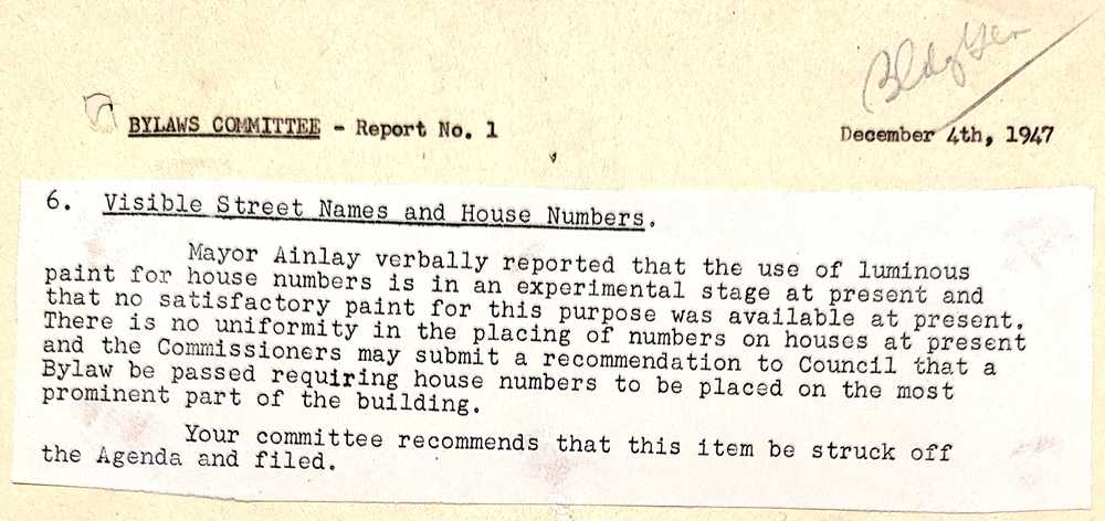 Mayor Harry Ainley reports to the Bylaws Committee about house numbers and luminous paint.