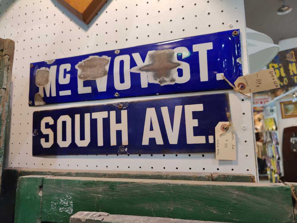 A couple random street signs on sale for $70 and $120.