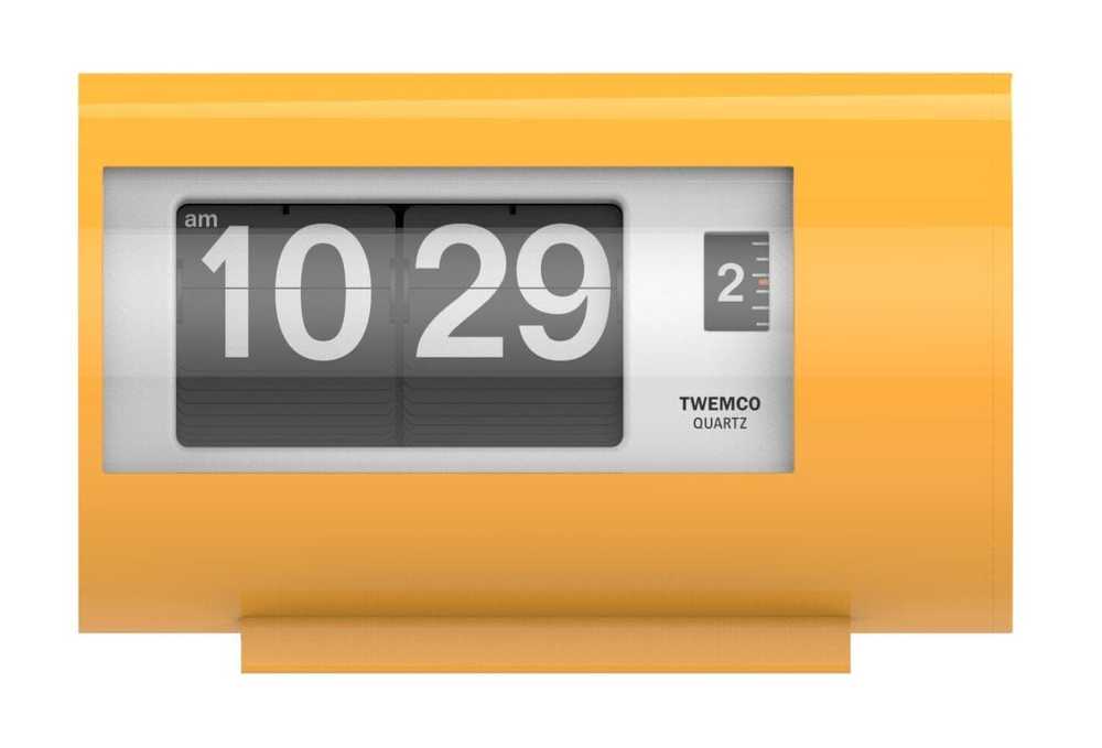 A Twemco yellow plastic flip alarm clock.