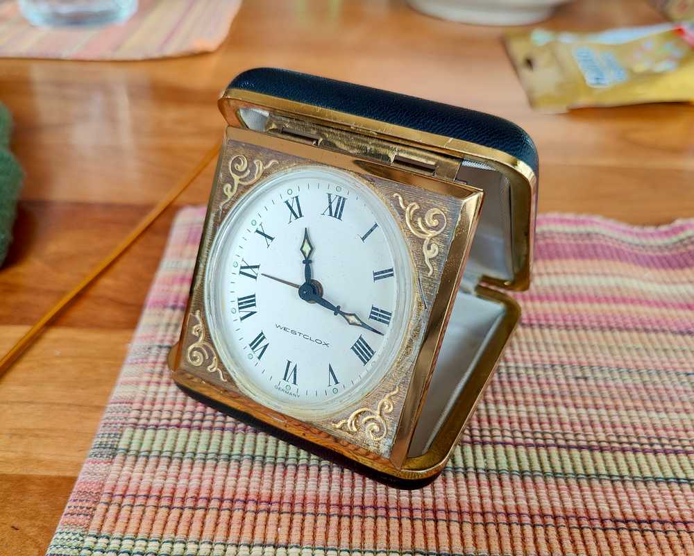 A vintage Westclox travel alarm clock.